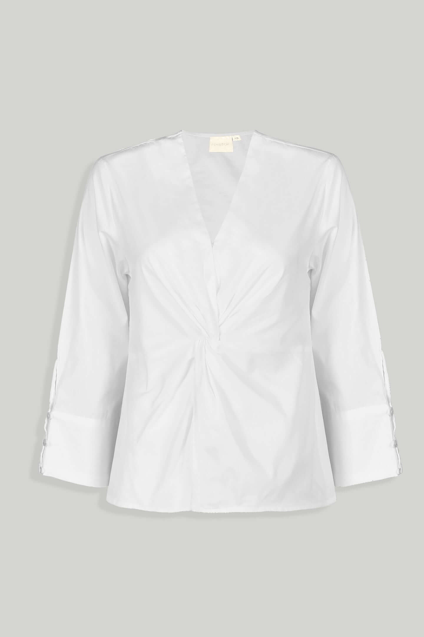 White blouse with front twist by reistor with three quarter sleeves and buttoned cuffs.